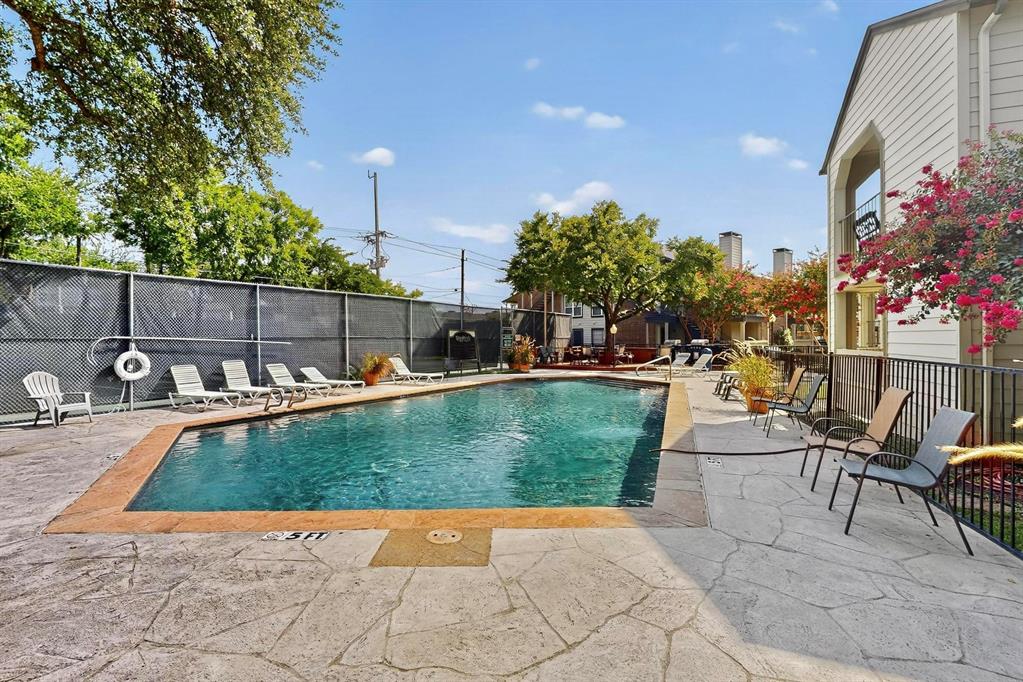 a view of a swimming pool with chairs