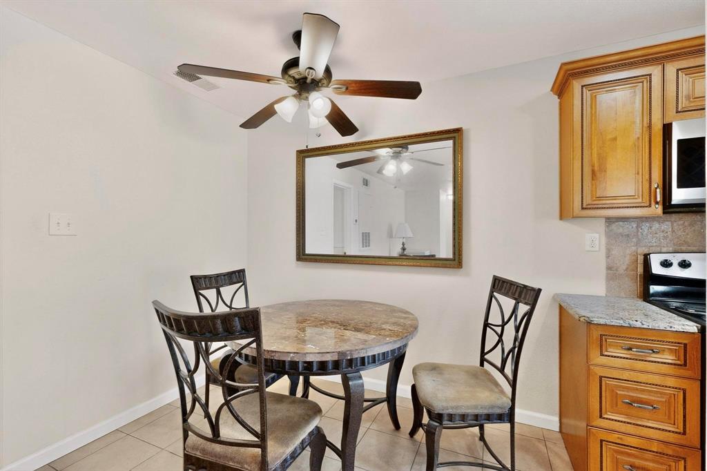 5981 Arapaho Road, Unit 901 Dallas, TX 75248 - Photo 18 of 38 a view of a dining room with furniture and a window