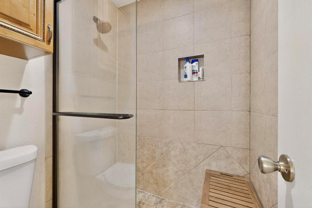 5981 Arapaho Road, Unit 901 Dallas, TX 75248 - Photo 28 of 38 a bathroom with a shower