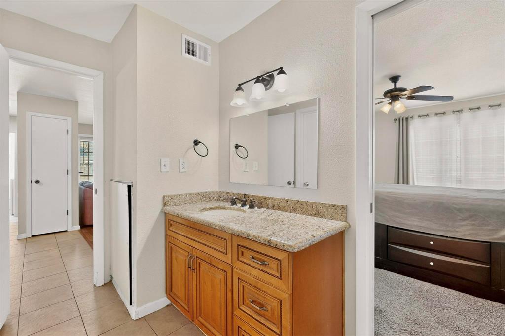 5981 Arapaho Road, Unit 901 Dallas, TX 75248 - Photo 29 of 38 a view of kitchen island with tub sink and cabinets