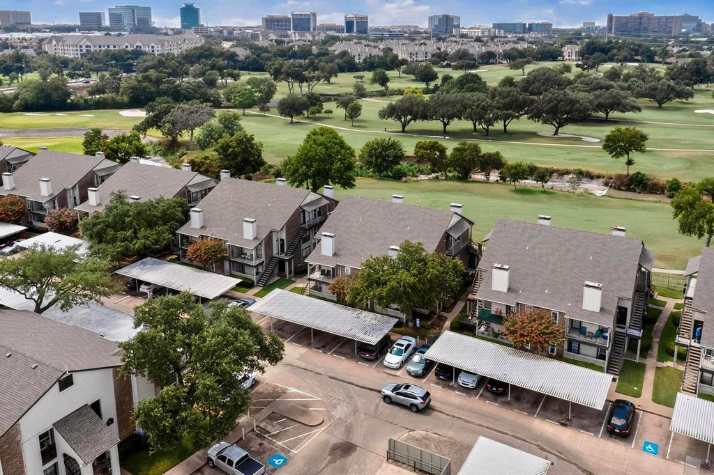 5981 Arapaho Road, Unit 901 Dallas, TX 75248 - Photo 36 of 38 an aerial view of a house with a garden and lake view