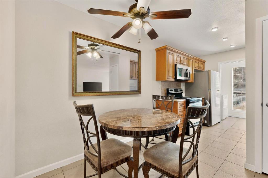 5981 Arapaho Road, Unit 901 Dallas, TX 75248 - Photo 10 of 38 a view of a dining room with furniture
