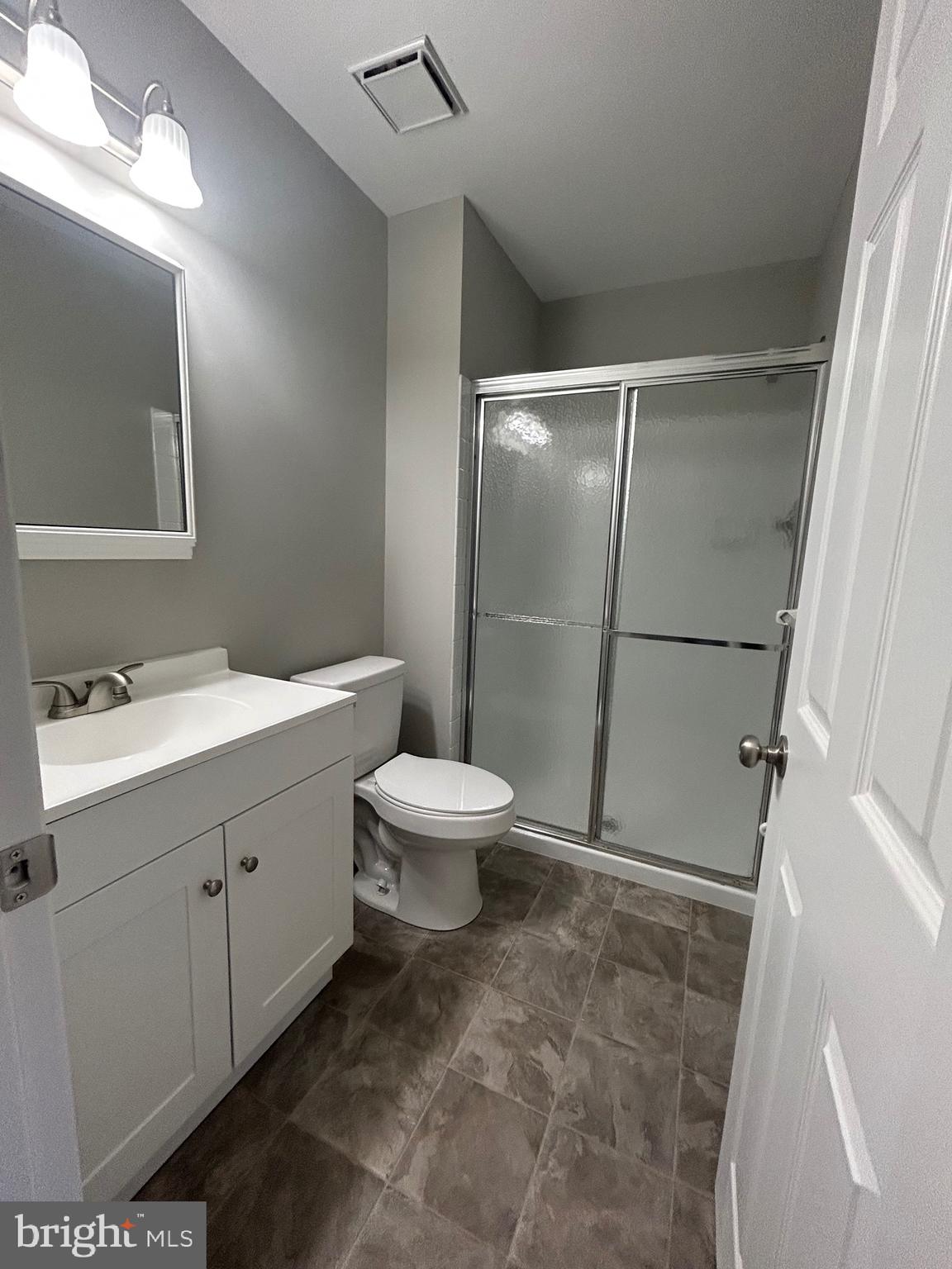 428 B Willow Turn Mount Laurel, NJ 08054 - Photo 11 of 16 a bathroom with a toilet sink and a mirror