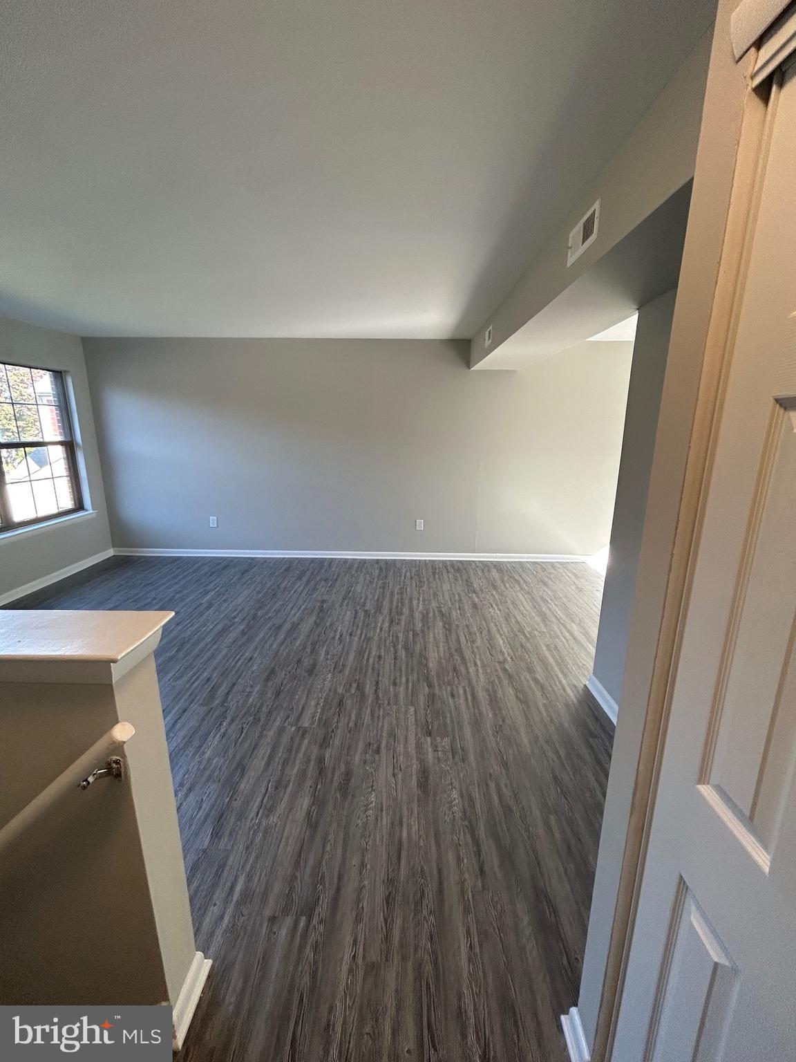 428 B Willow Turn Mount Laurel, NJ 08054 - Photo 12 of 16 wooden floor in an empty room with a window