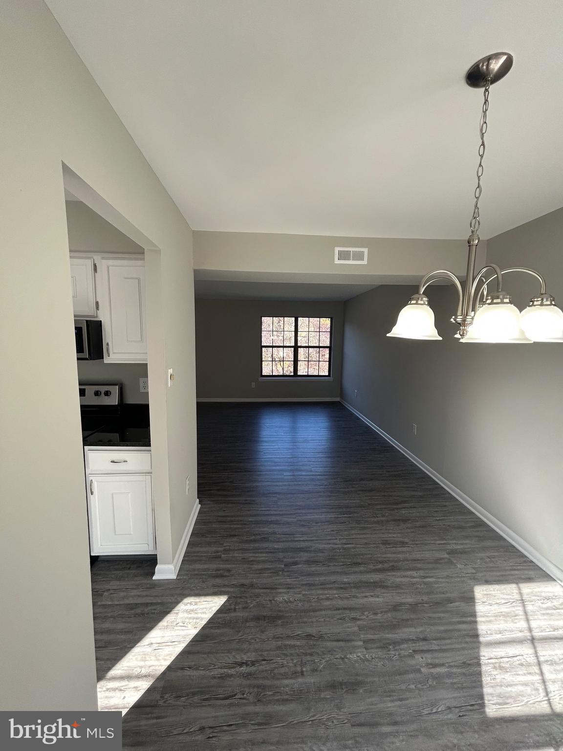 428 B Willow Turn Mount Laurel, NJ 08054 - Photo 14 of 16 a view of a hallway with wooden floor and a fireplace