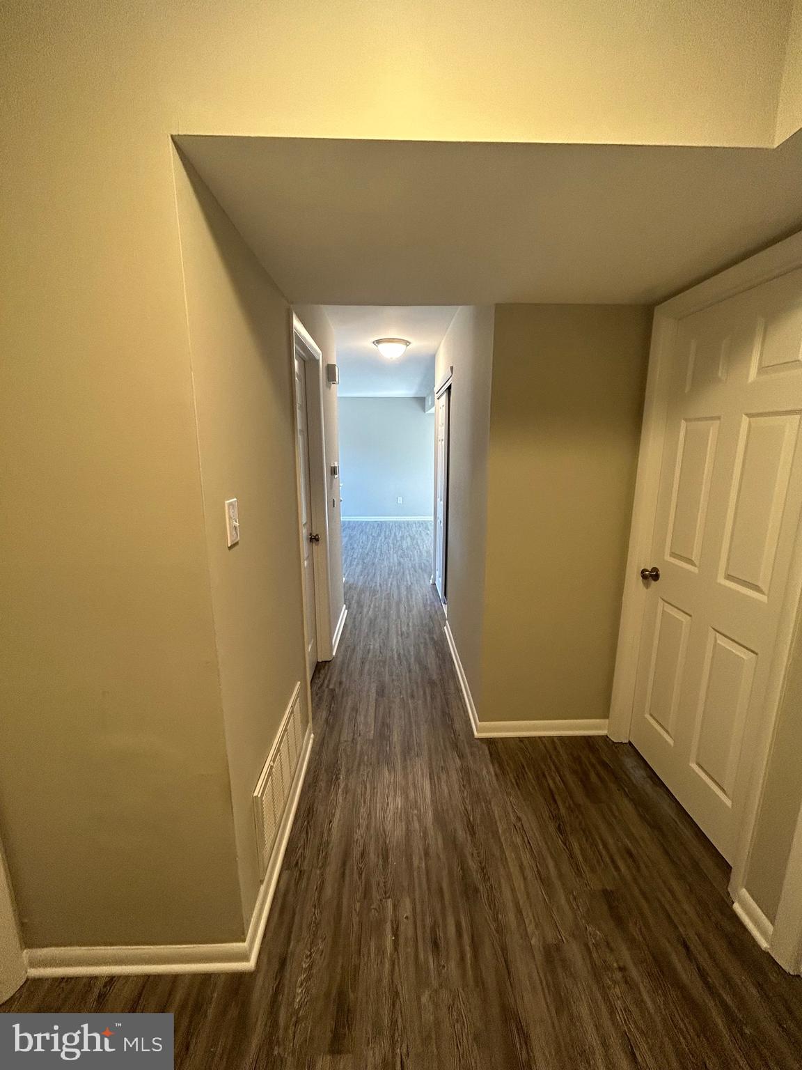 428 B Willow Turn Mount Laurel, NJ 08054 - Photo 4 of 16 a view of a hallway with wooden floor