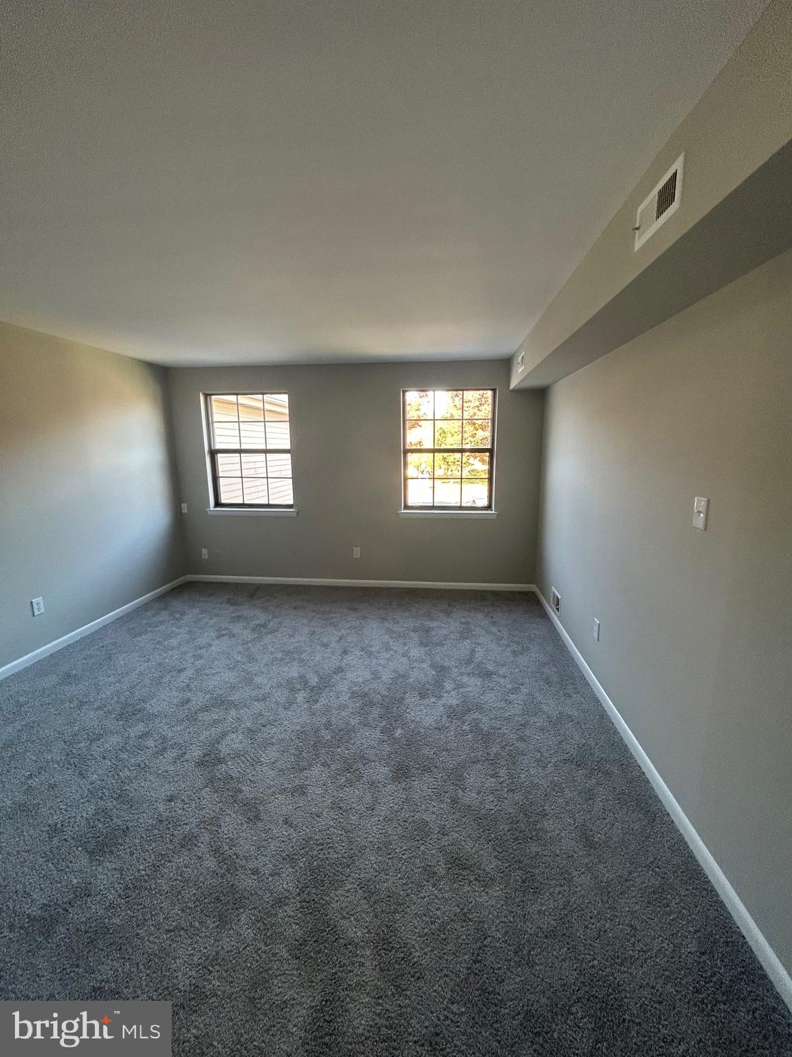 428 B Willow Turn Mount Laurel, NJ 08054 - Photo 5 of 16 a view of an empty room with windows