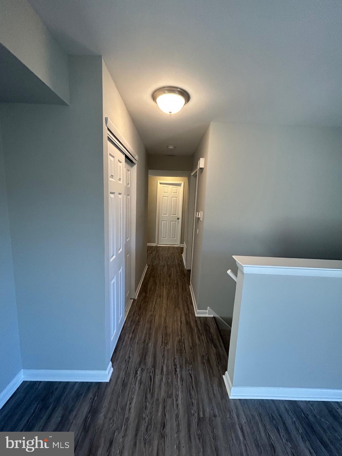 428 B Willow Turn Mount Laurel, NJ 08054 - Photo 6 of 16 a view of a hallway with wooden floor
