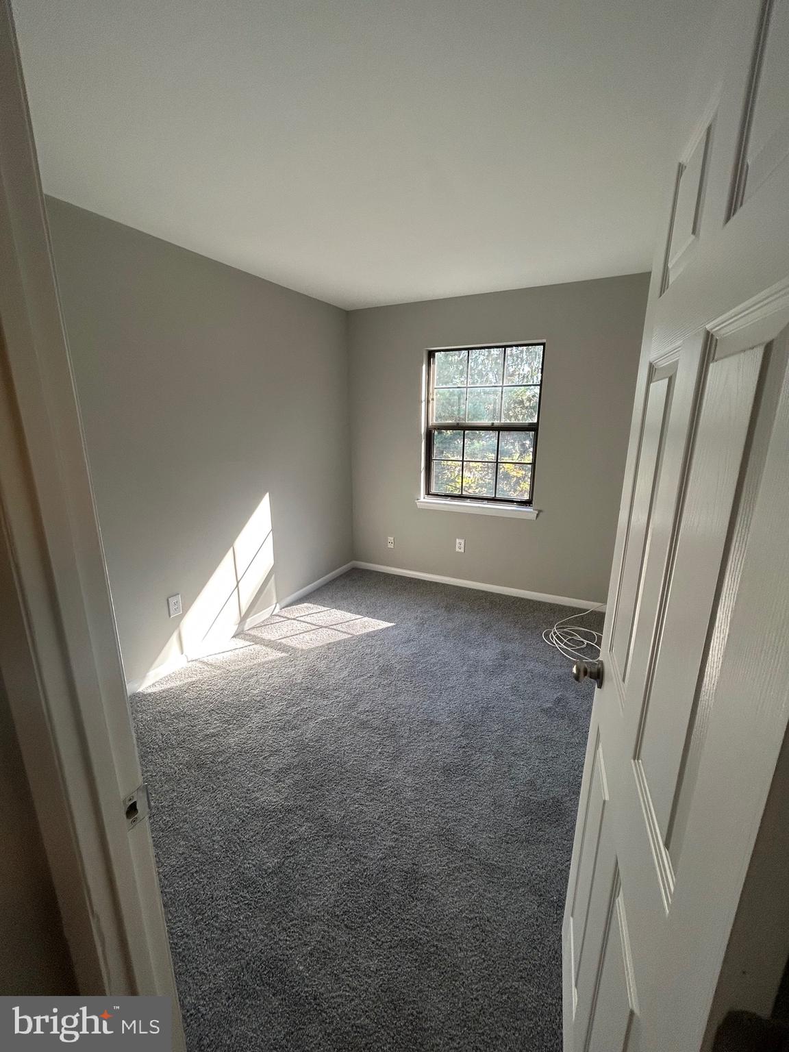 428 B Willow Turn Mount Laurel, NJ 08054 - Photo 8 of 16 a view of an empty room with a window