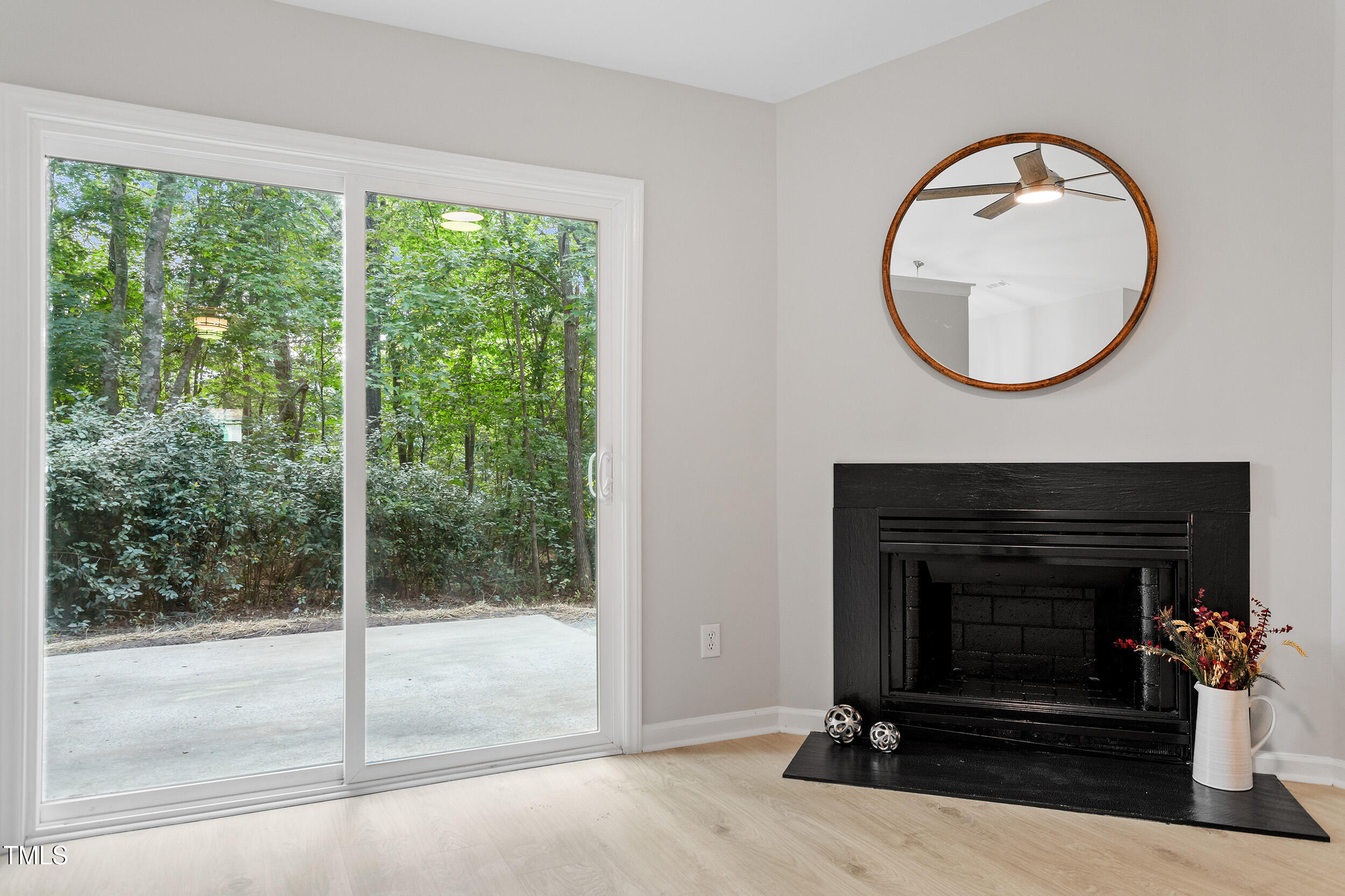 20 Meadowcrest Drive Durham, NC 27703 - Photo 15 of 28 a living room with a fireplace and a floor to ceiling window