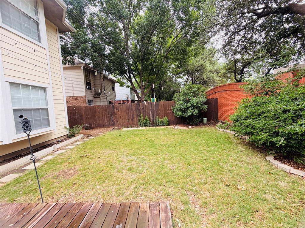 434 Moonlight Way Irving, TX 75063 - Photo 26 of 29 a view of a backyard with a large tree