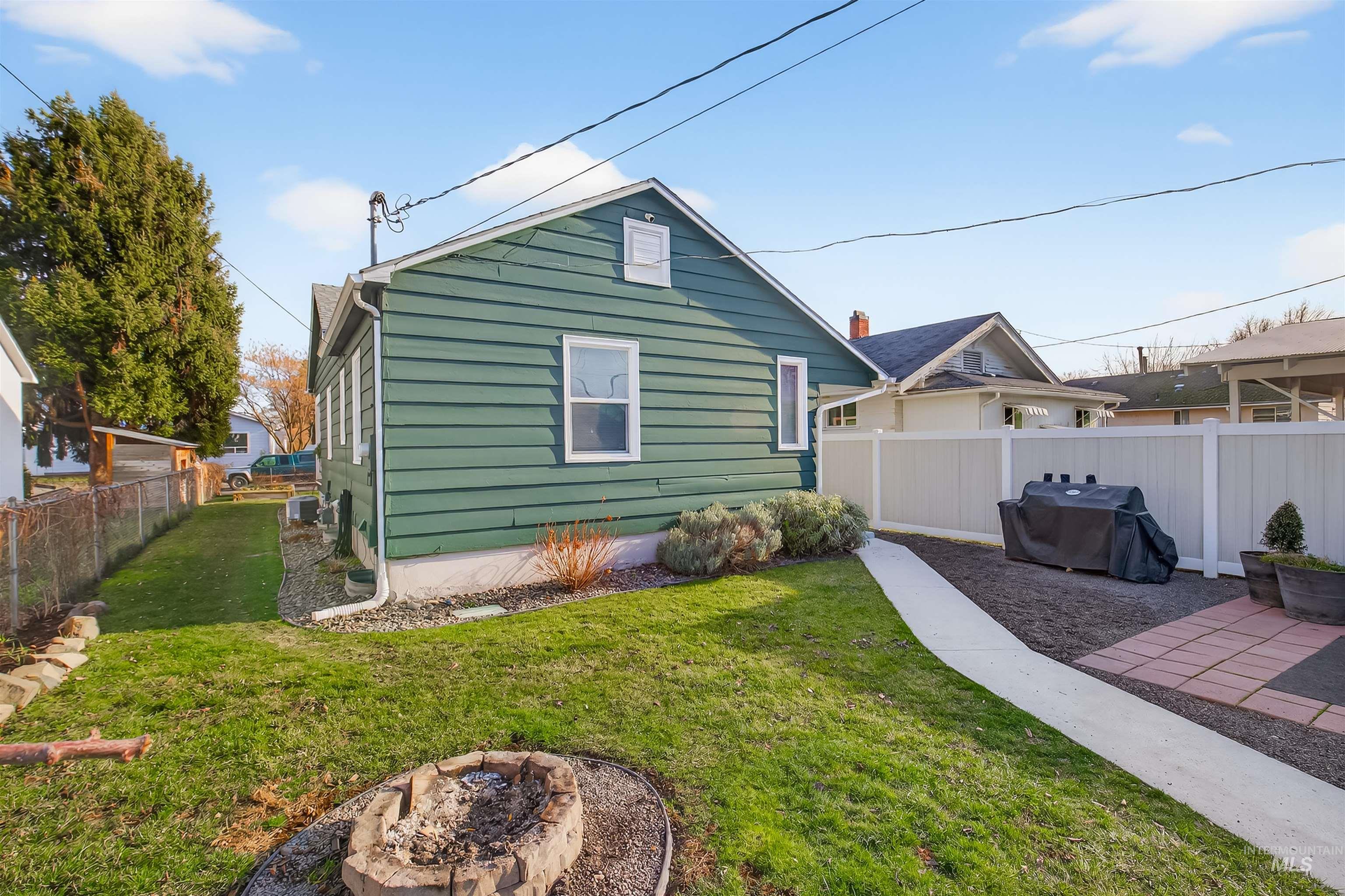 810 3rd Street Clarkston, WA 99403 - Photo 46 of 46 Rear view of property with a fenced backyard and a fire pit