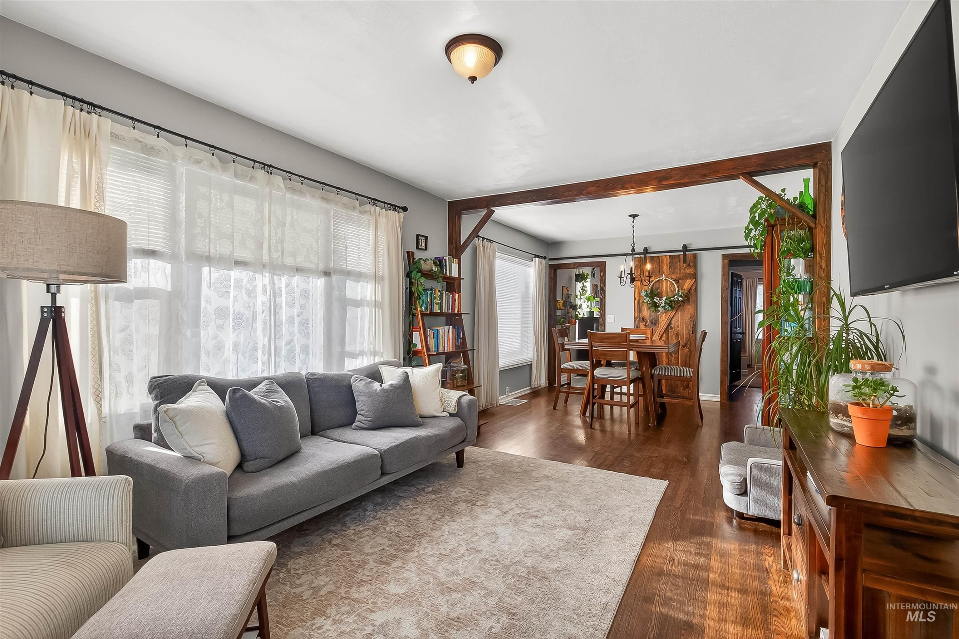 810 3rd Street Clarkston, WA 99403 - Photo 7 of 46 Living area featuring dark wood-style floors and baseboards