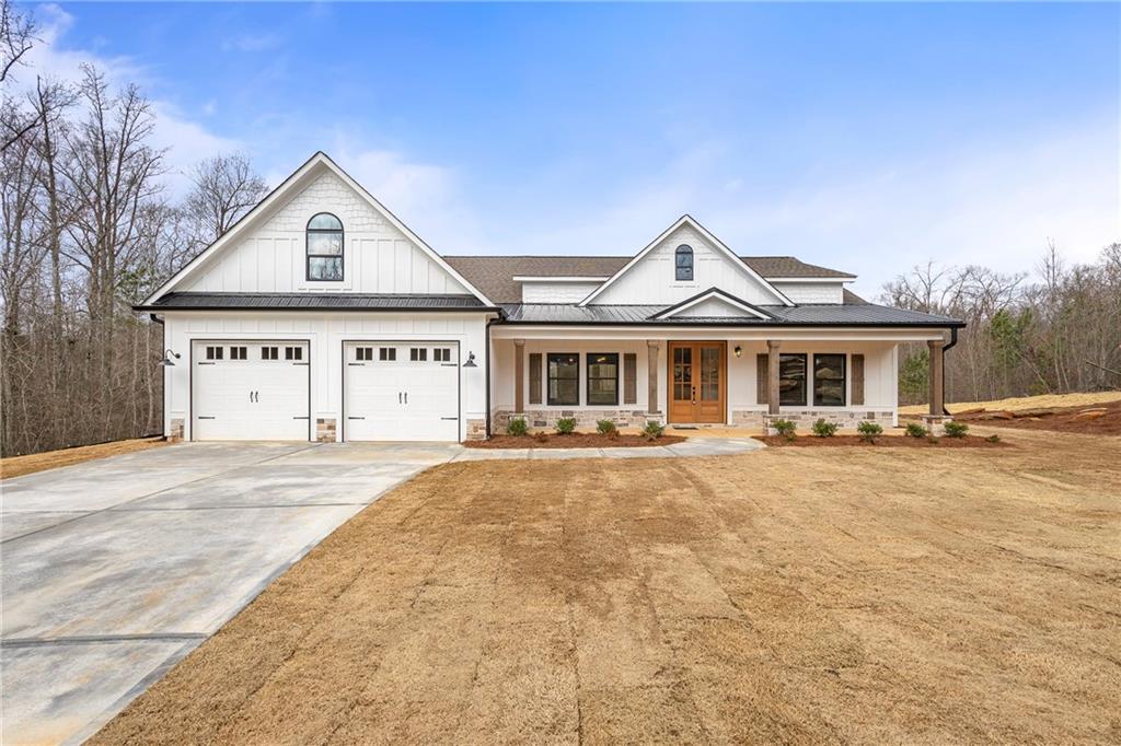 170 Sand Hawk Trail Villa Rica, GA 30180 - Photo 1 of 1 a front view of a house with yard and garage
