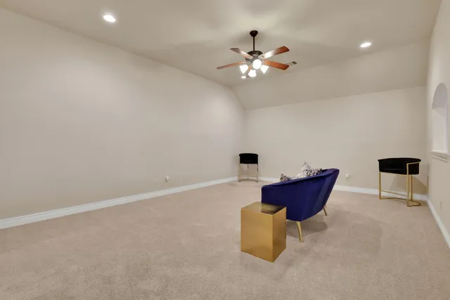 a bedroom with furniture and chandelier