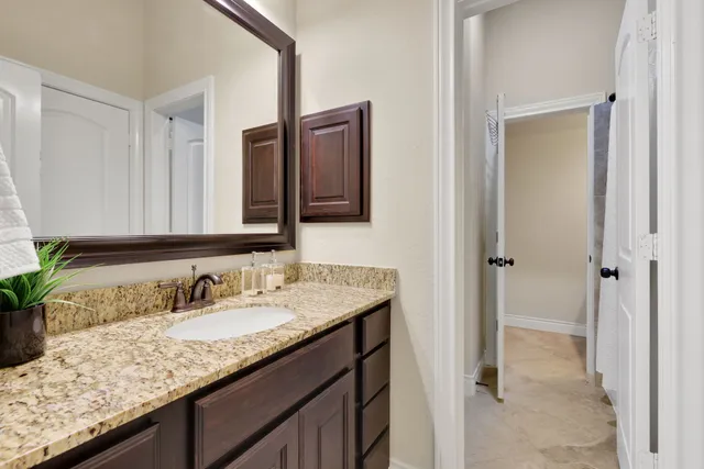 a bedroom with a bed and couch