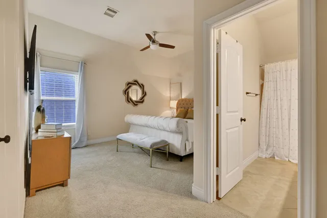 a bathroom with a granite countertop sink and a mirror with toilet