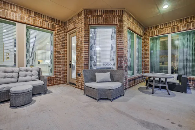 a living room with furniture and a gate