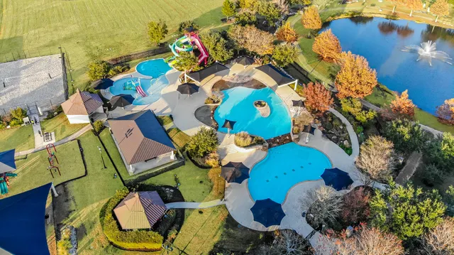 an aerial view of a house with a ocean view