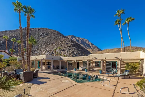 a front view of a building with sitting area