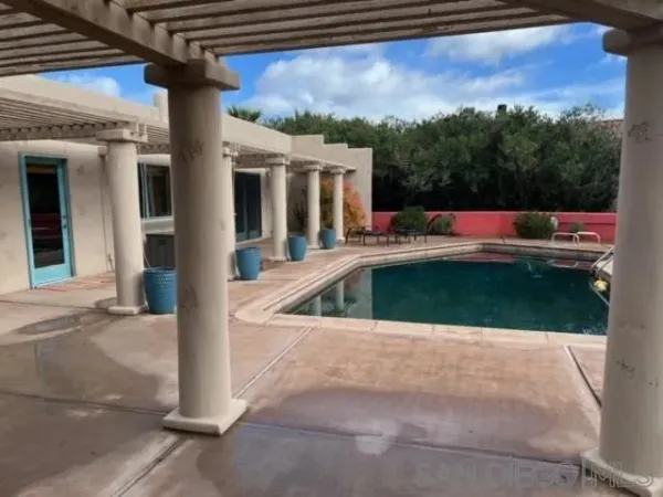 a view of swimming pool from a balcony