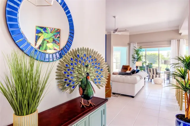 a view of a bedroom with furniture and a potted plant