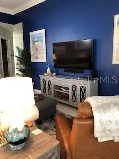 a bed room with a bed and a large window