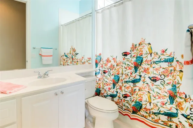 a living room with furniture a rug and a large window