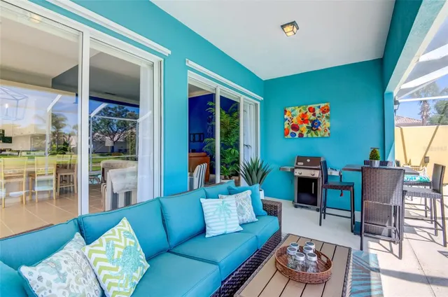 a building outdoor space with patio lots of furniture and plants