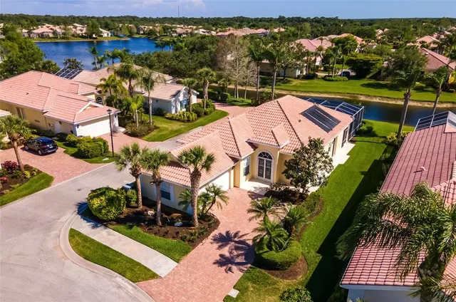 an aerial view of a house with a lake view