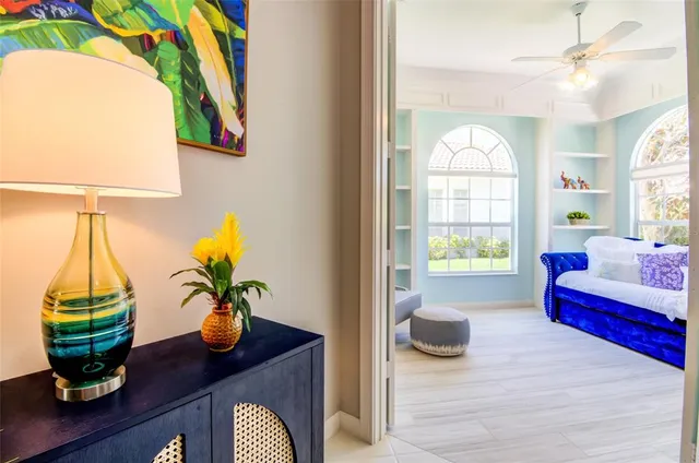 a view of living room with furniture and a potted plant