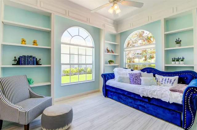 a living room with furniture and a large window