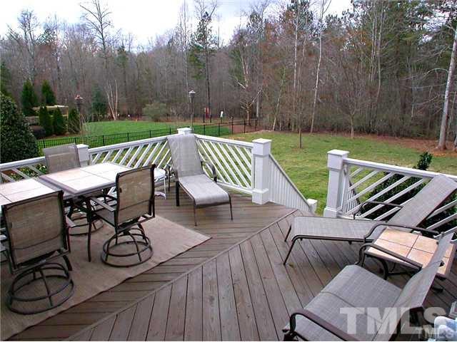 1320 Wynncrest Court Raleigh, NC 27603 - Photo 22 of 25 Large deck overlooks manicured back yard.