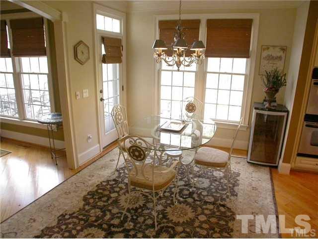 1320 Wynncrest Court Raleigh, NC 27603 - Photo 8 of 25 Inviting breakfast room with windows and light with easy access to the back deck.