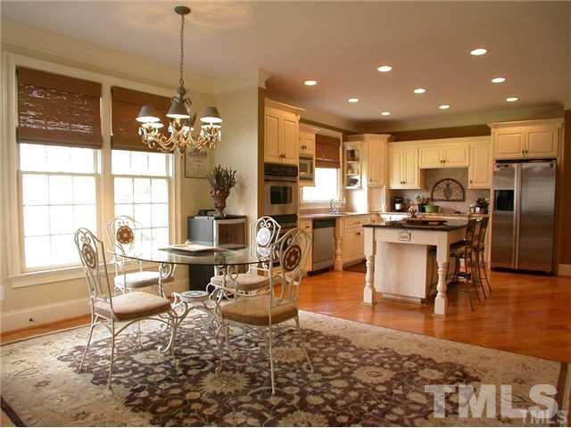 1320 Wynncrest Court Raleigh, NC 27603 - Photo 10 of 25 Breakfast area provides nince transition to the family room and kitchen.