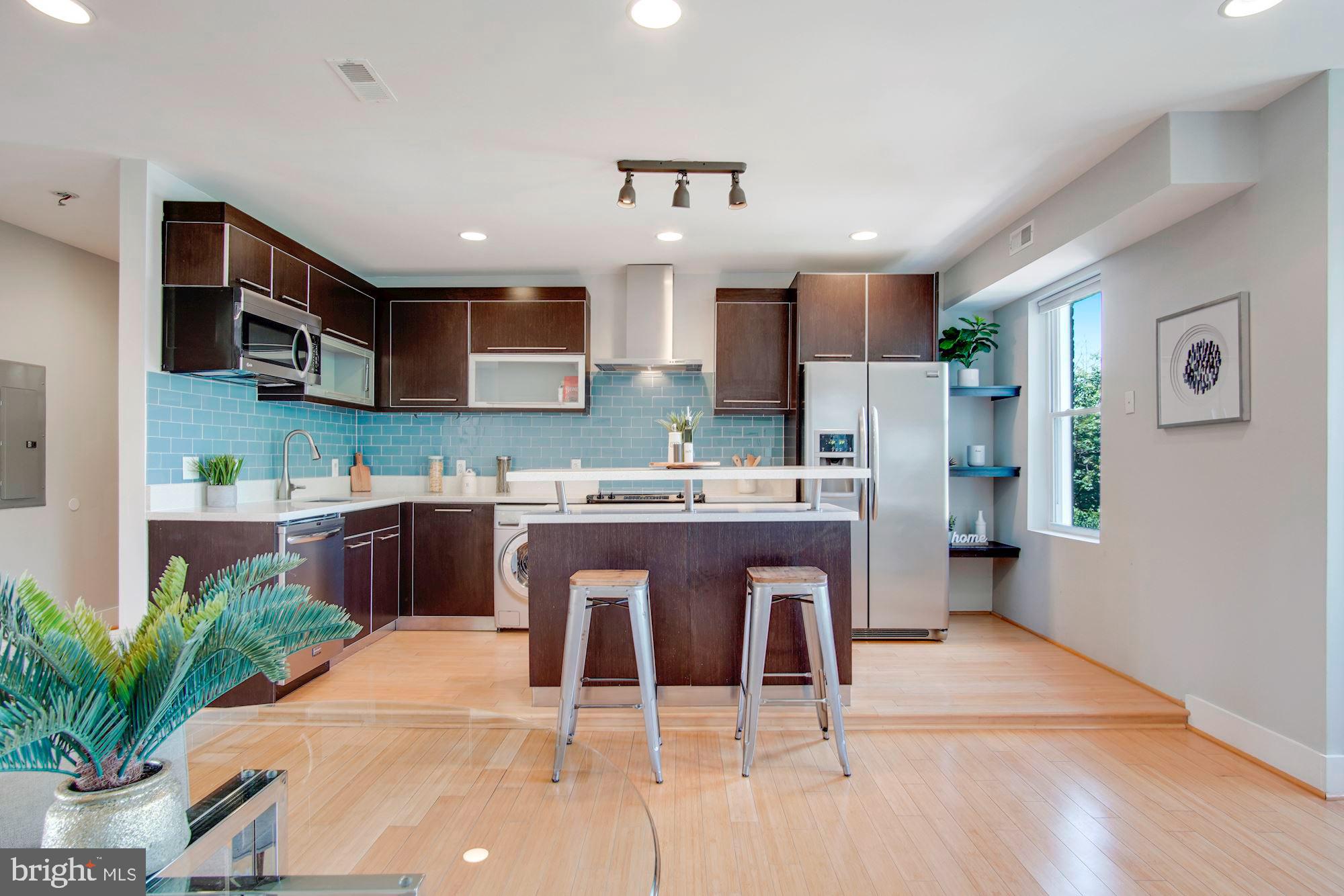 1409 G Street Northeast, Unit 21 Washington, DC 20002 - Photo 3 of 27 The kitchen is the heart of this lovely condo