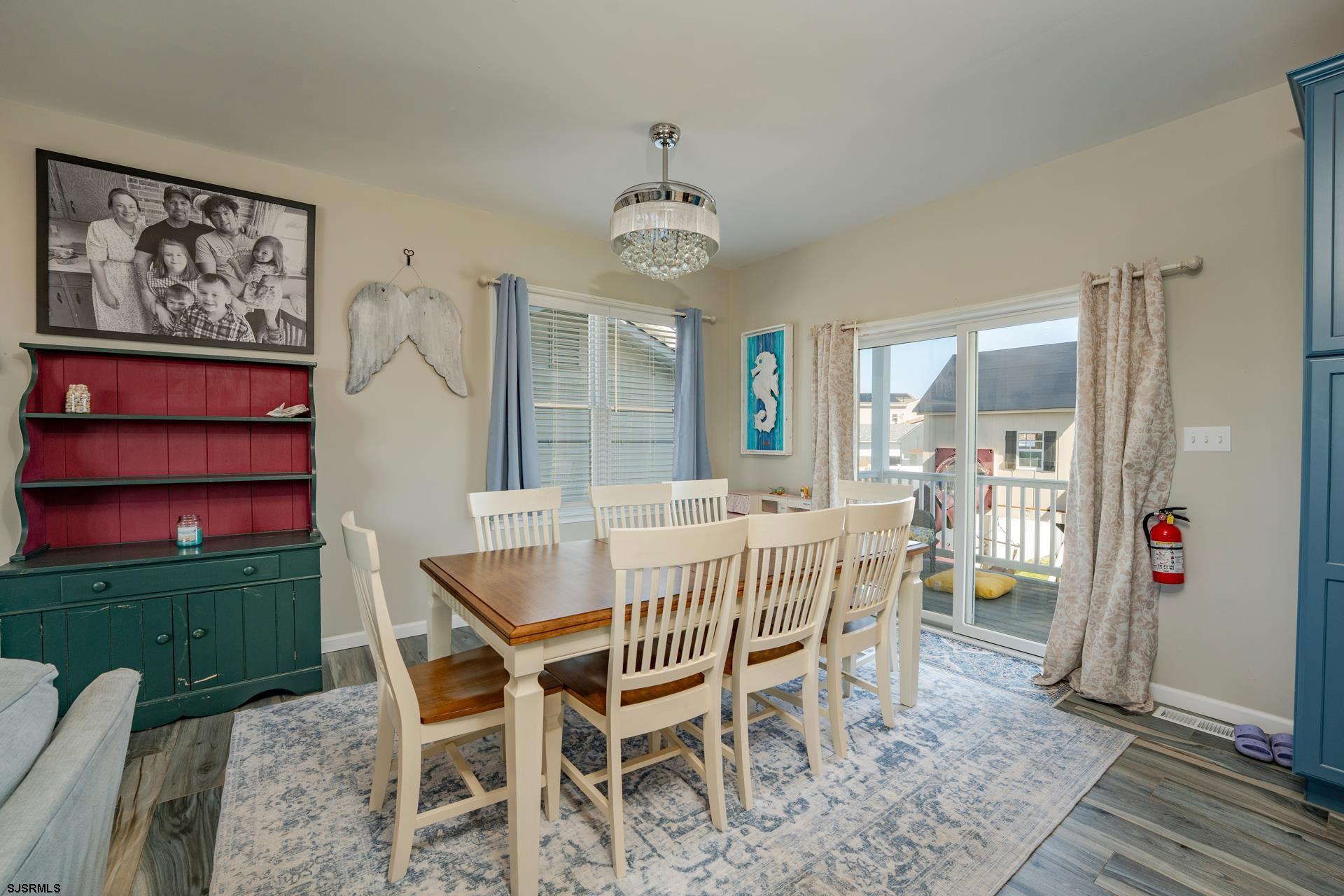 703 Bobby Jones Road Brigantine, NJ 08203 - Photo 6 of 34 a view of a dining room with furniture window and wooden floor