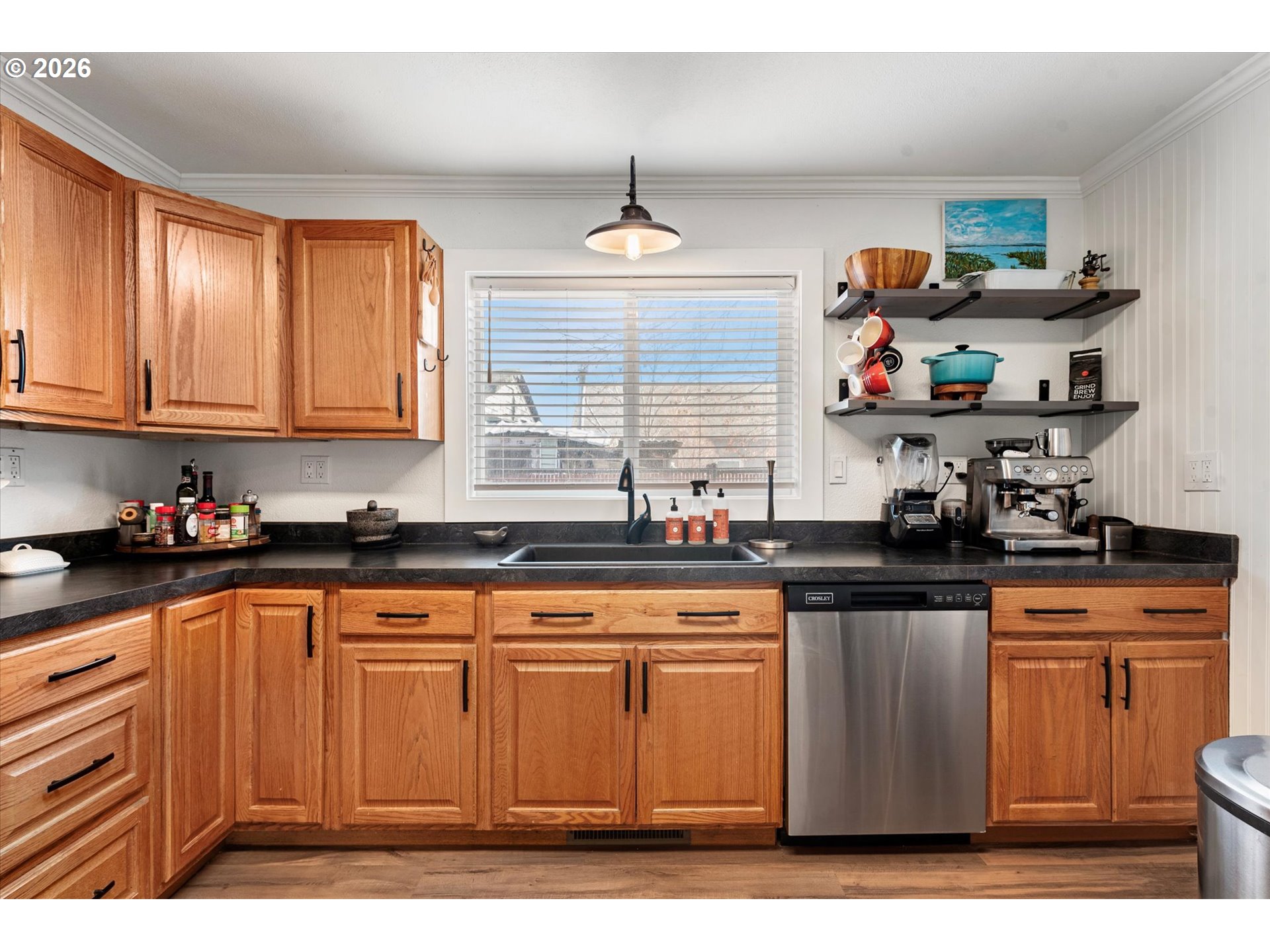 1660 Church Street Baker City, OR 97814 - Photo 12 of 25 a kitchen with stainless steel appliances granite countertop a sink dishwasher stove and cabinets