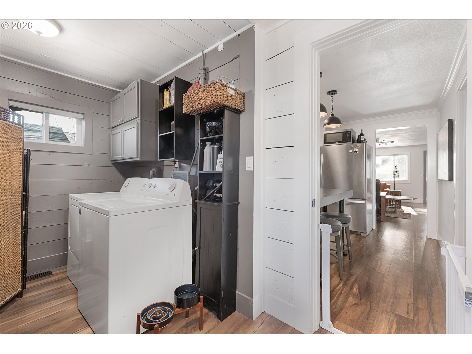 1660 Church Street Baker City, OR 97814 - Photo 19 of 25 a view of washer and dryer with kitchen in the background