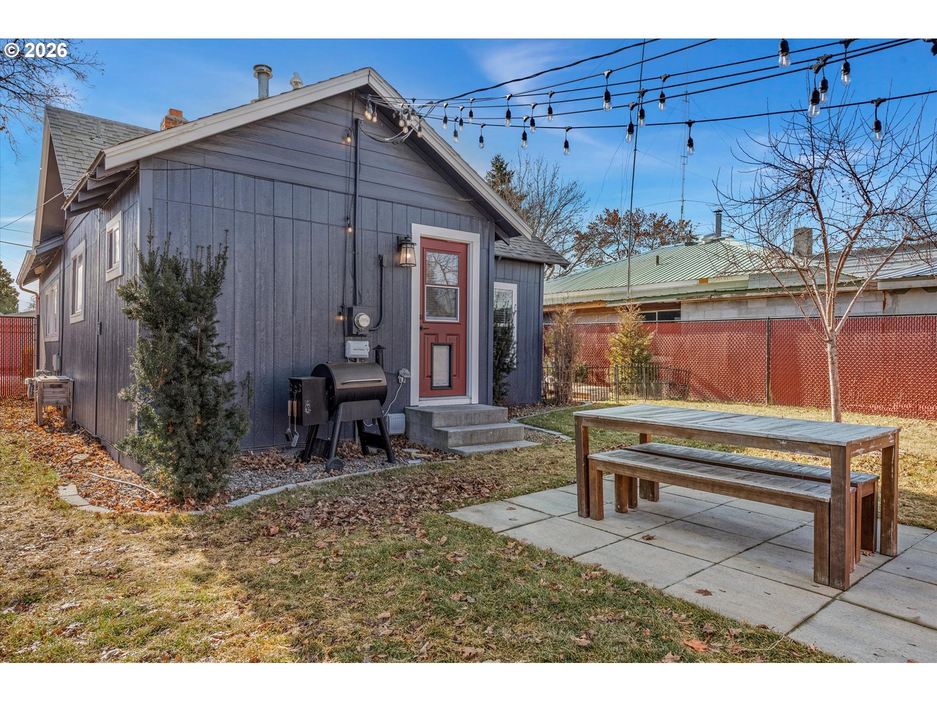 1660 Church Street Baker City, OR 97814 - Photo 25 of 25 a backyard of a house with barbeque oven table and chairs