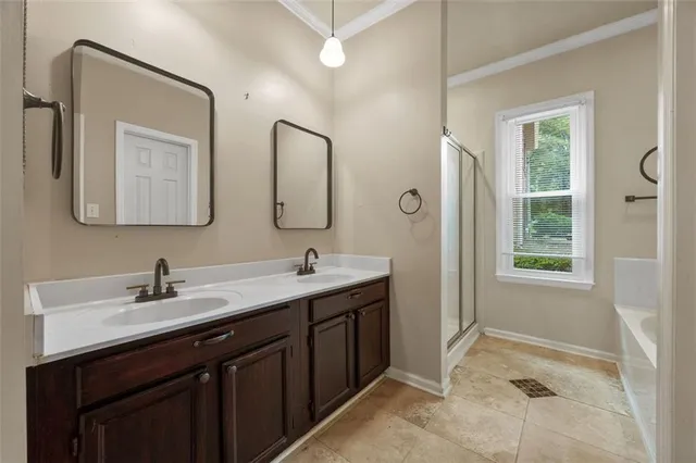 a bathroom with a double vanity sink and mirror