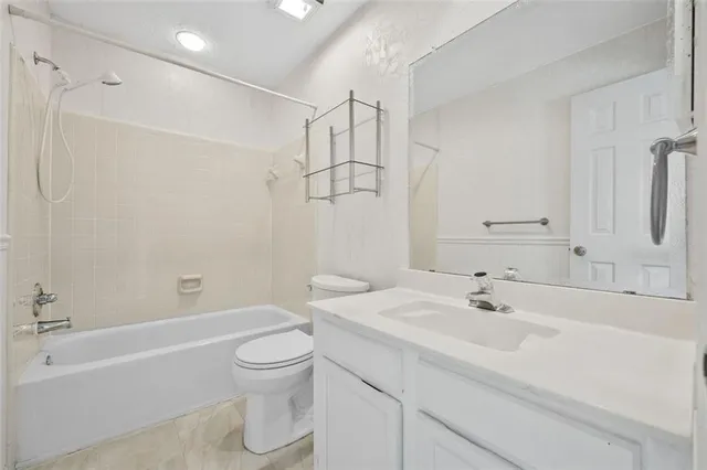 a bathroom with a sink a toilet and a bathtub