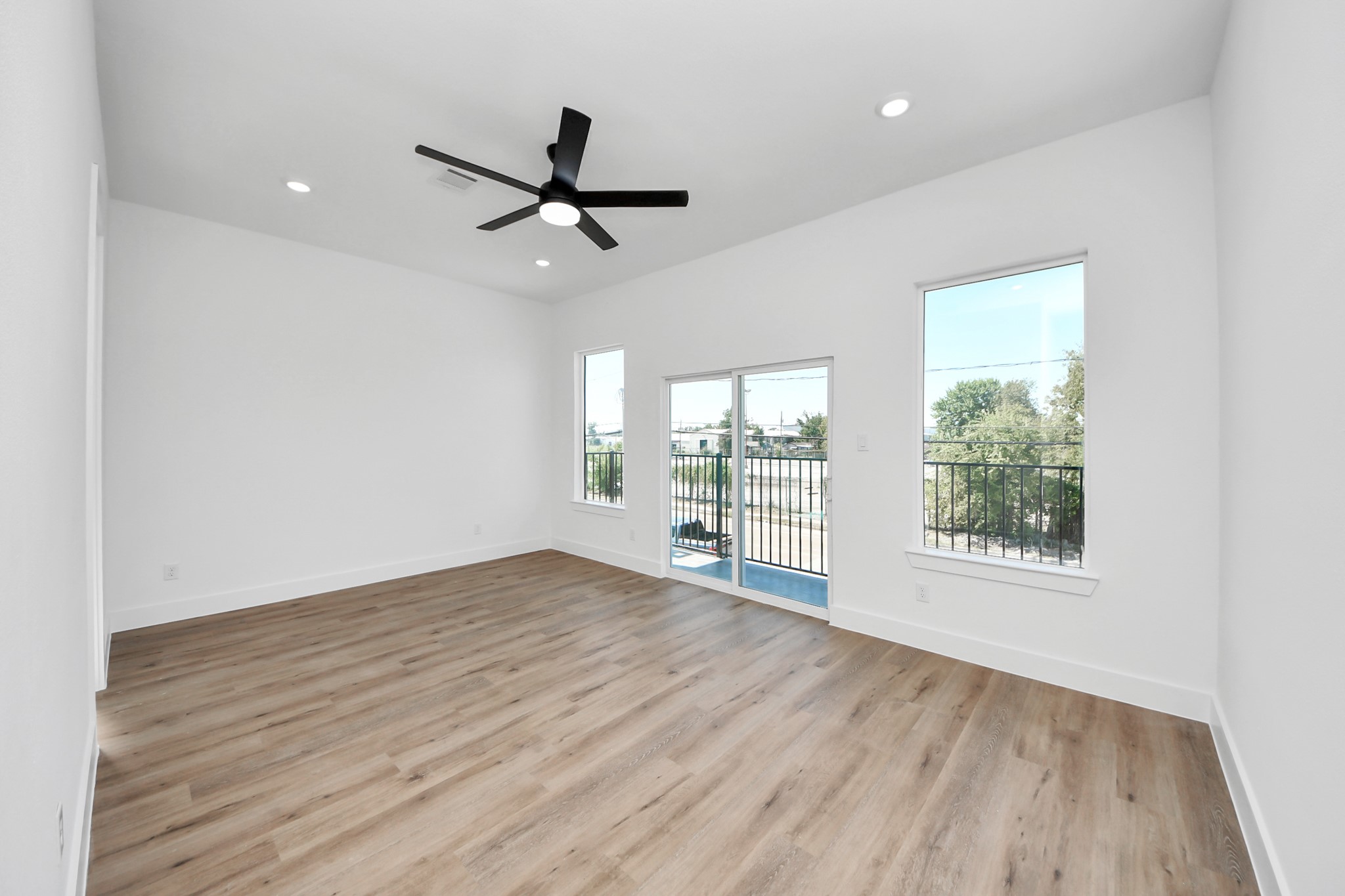 3310 Hardy Street Houston, TX 77009 - Photo 15 of 26 a view of an empty room with wooden floor and a window