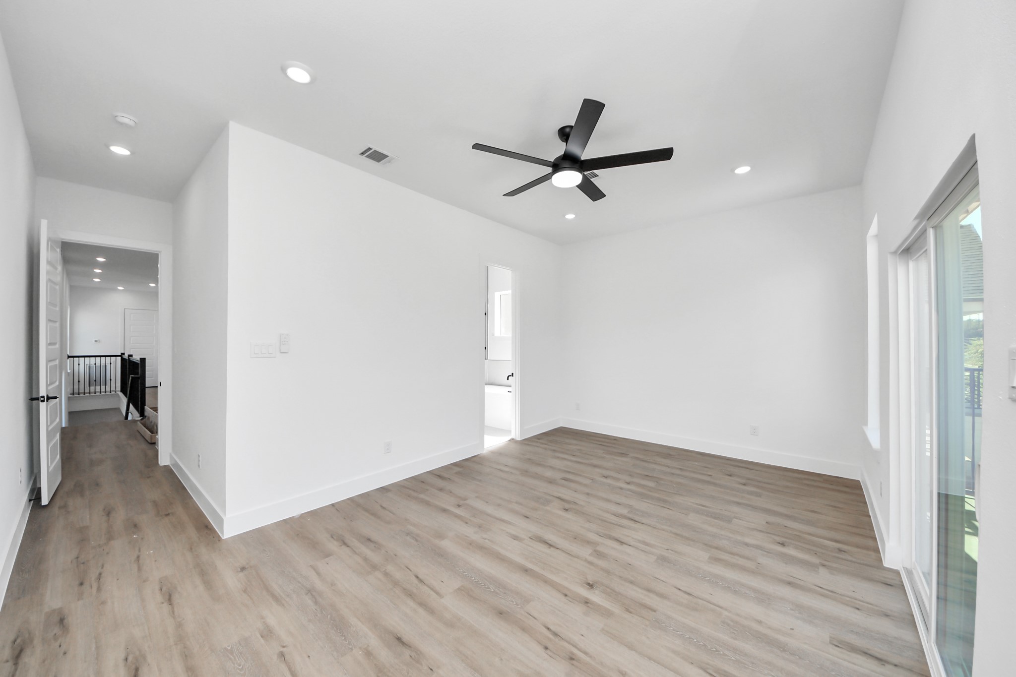 3310 Hardy Street Houston, TX 77009 - Photo 16 of 26 a view of a room with wooden floor and ceiling fan