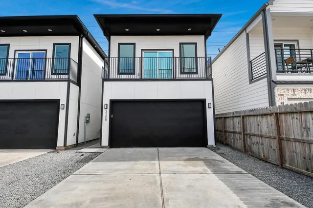 a front view of a house with a large windows