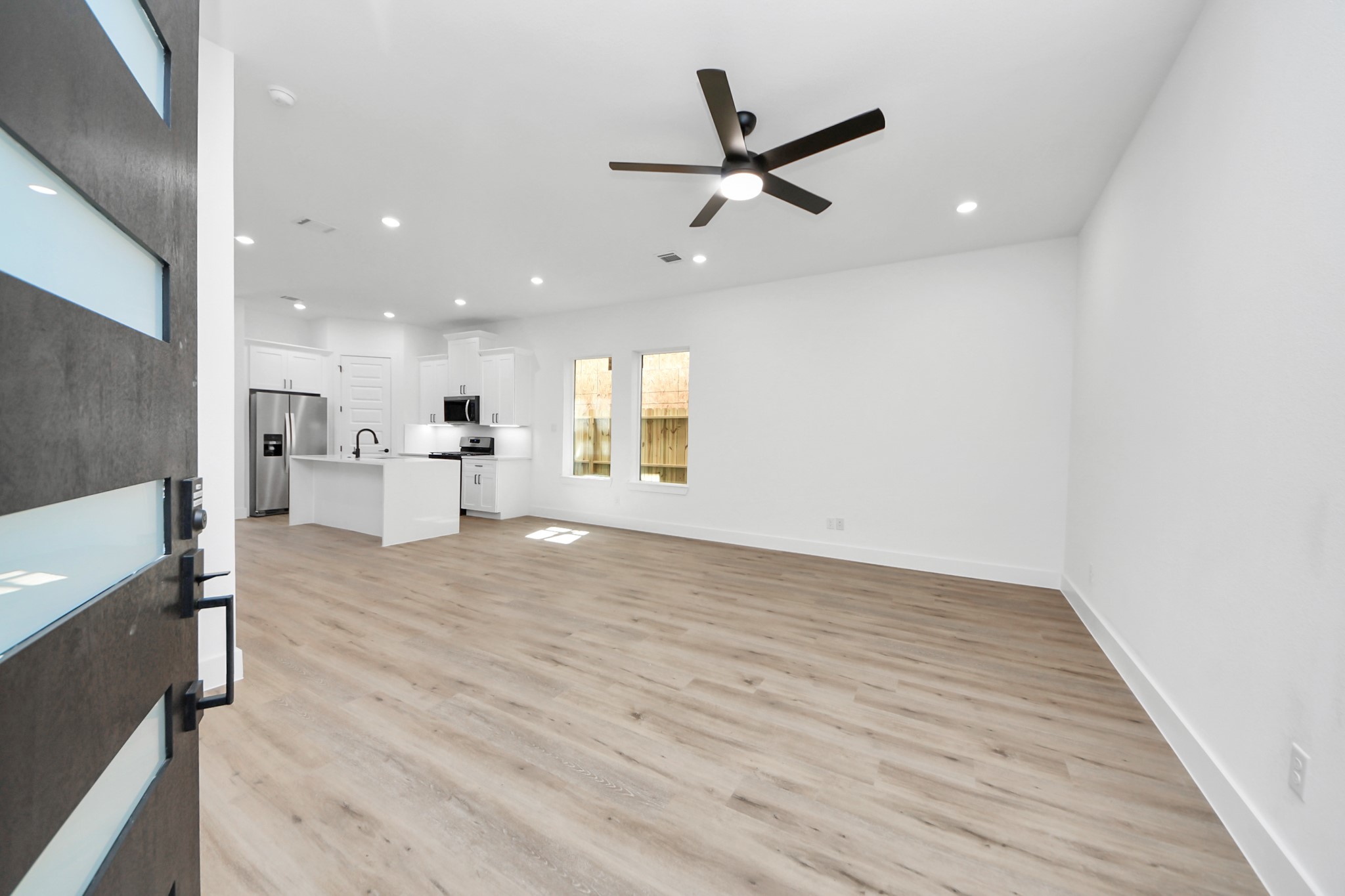 3310 Hardy Street Houston, TX 77009 - Photo 3 of 26 a view of a kitchen with a sink and a refrigerator