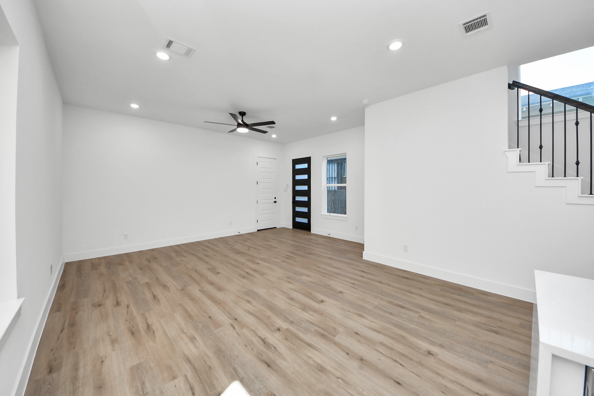 3310 Hardy Street Houston, TX 77009 - Photo 6 of 26 a view of empty room with wooden floor