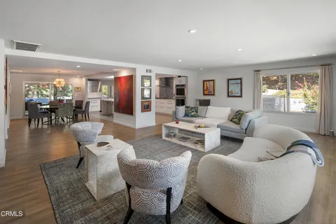 a view of a dining room with furniture window and wooden floor