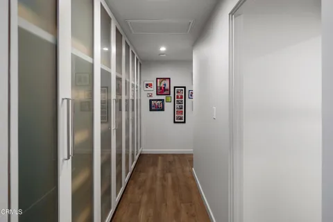 a bedroom with a large bed and a ceiling fan