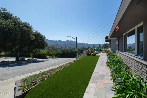 a view of a pathway with a yard
